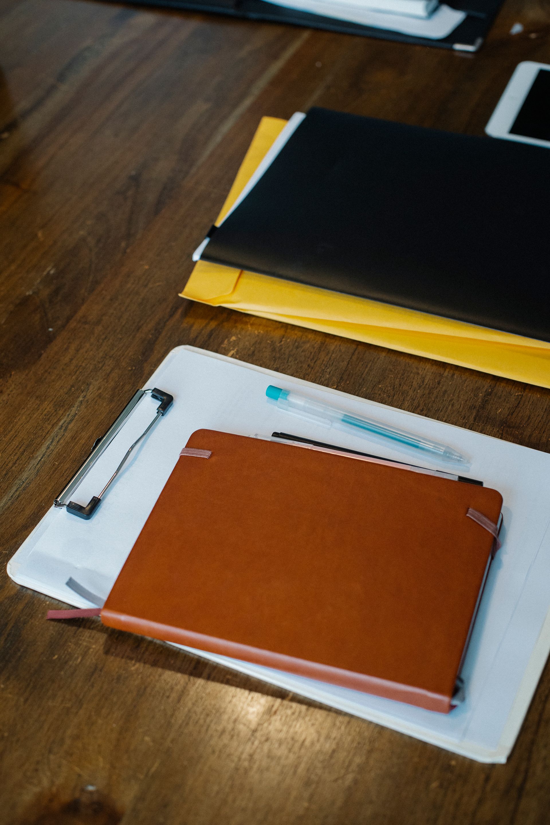 Dispatch paperwork and rate confirmation documents on a desk